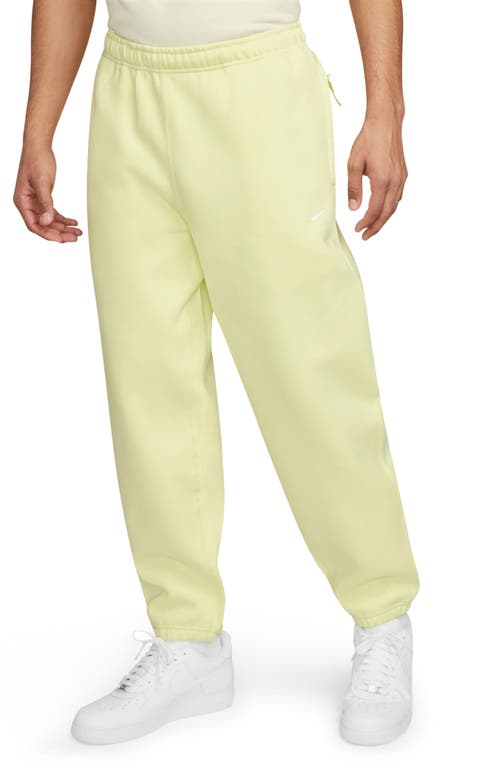 Nike Solo Swoosh Fleece Sweatpants In Luminous Green/white