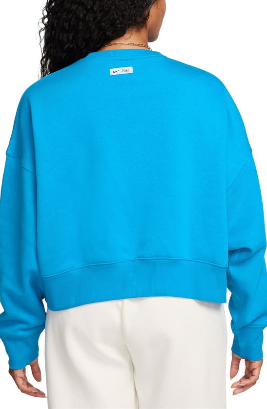 Shop Nike Phoenix Fleece Varsity Oversize Crewneck Sweatshirt In Blue Stardust