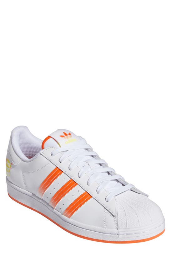 Adidas Originals Superstar Sneaker In Ftwr White/ Impact Orange