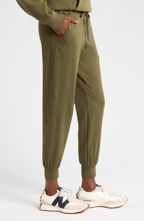 Shop Zella Move In Pocket Joggers In Olive Night