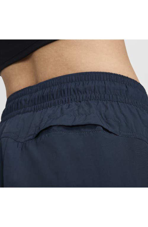 Shop Nike Sportswear Repel Zip Hem Pants In Armory Navy/black