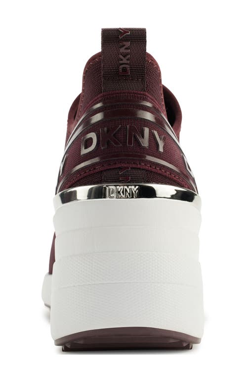 Shop Dkny Keeva Wedge Knit Sneaker In Wine