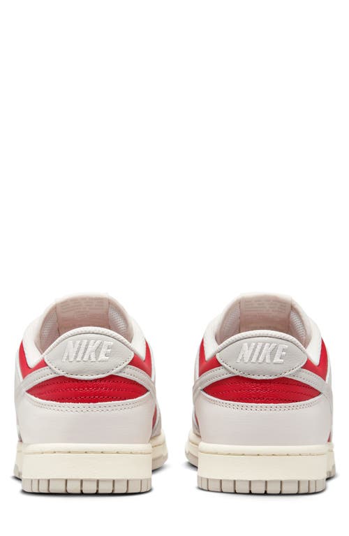 Shop Nike Dunk Low Retro Basketball Sneaker In Phantom/light Iron Ore/red