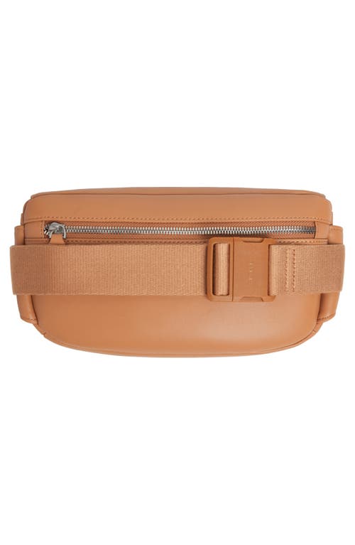 Shop Monos Metro Sling Bag In Saddle Tan