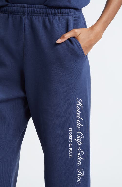 Shop Sporty And Rich Sporty & Rich Hotel Du Cap Cursive Cotton Sweatpants In Navy