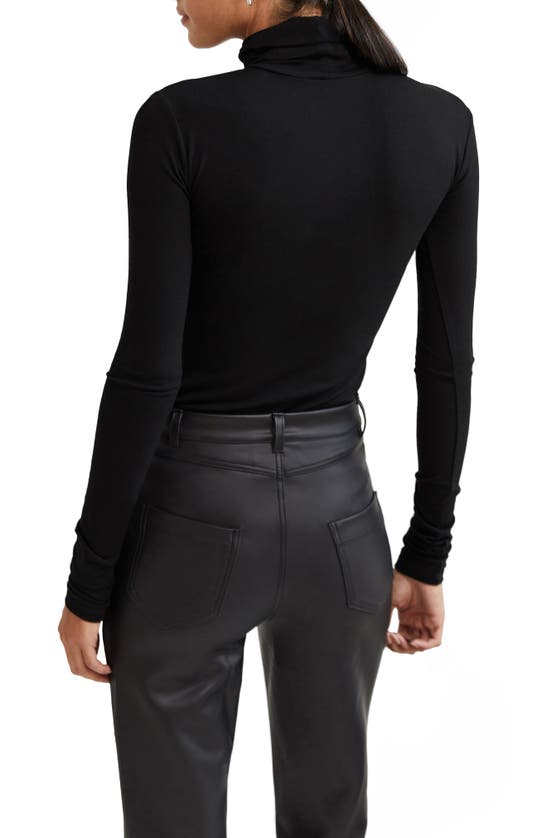 Marcella Dahlia Cutout Turtleneck Top In Black