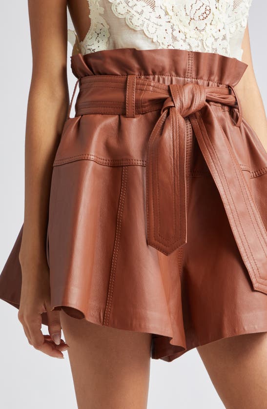 Shop Zimmermann Harmony Belted Leather Shorts In Toffee