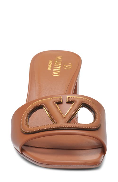 Shop Valentino Garavani Vlogo Cutout Slide Sandal In Almond Beige/antique Brass