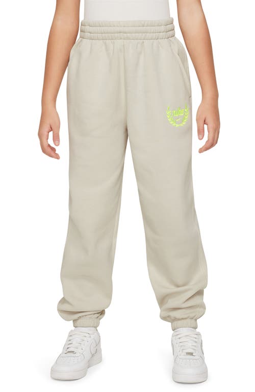 Shop Nike Kids' Club Cotton Blend Fleece Sweatpants In Light Bone/volt