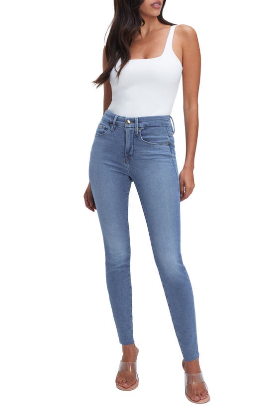 Shop Good American Good Legs Raw Hem Mid Rise Skinny Jeans In Blue655