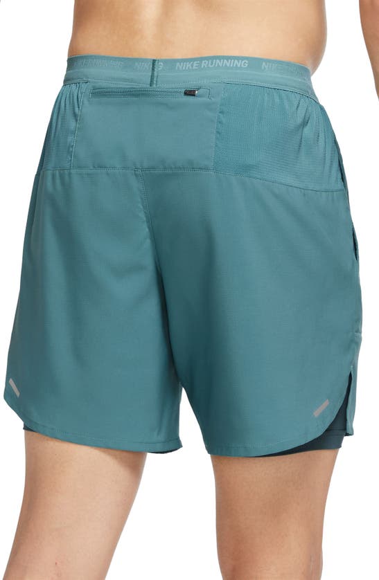 Shop Nike Dri-fit Stride 2-in-1 Running Shorts In Mineral Teal/ Reflective Silv