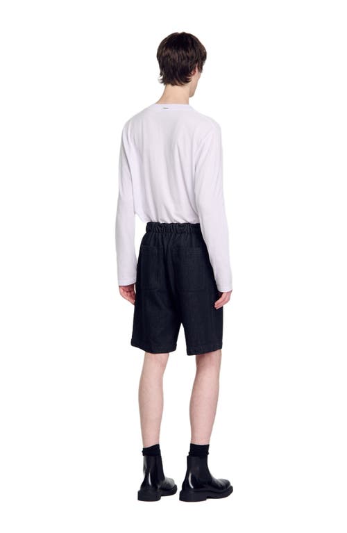 Shop Sandro Raw Denim Bermuda Shorts In Black