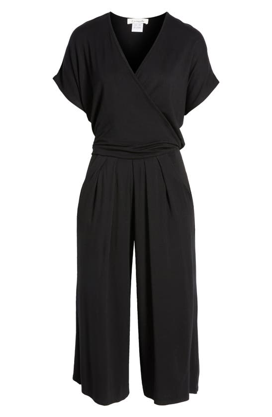 Shop Loveappella Short Sleeve Wrap Front Crop Jumpsuit In Black