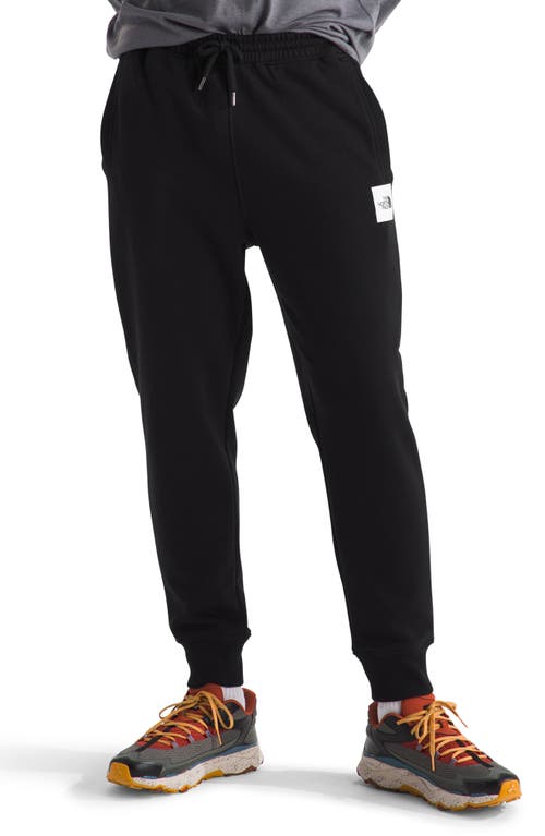 Shop The North Face Core Joggers In Tnf Black/tnf White