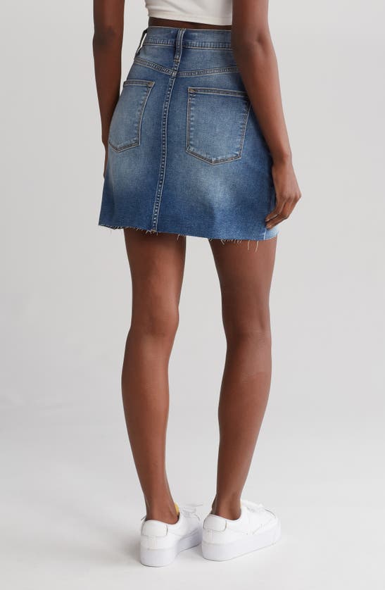 Shop Vigoss Raw Hem Denim Miniskirt In Medium Wash