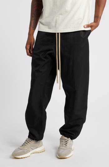 Fear of God Essentials Gender Inclusive Textured Nylon Track Pants |  Nordstrom