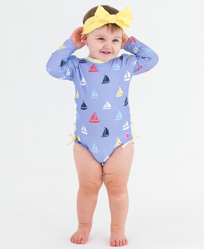 Rufflebutts Baby Girls Long Sleeve Upf50+ One Piece Rash Guard In Flamingo Frenzy