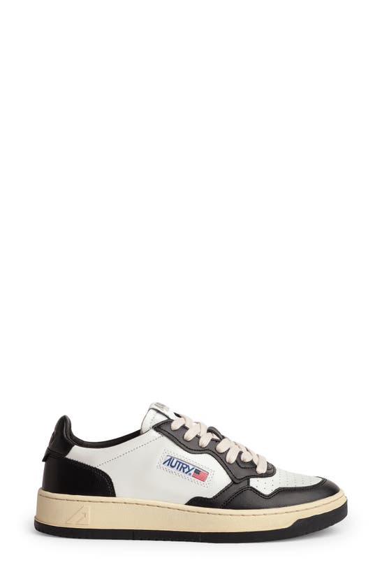 Shop Autry Medalist Low Sneaker In White/black