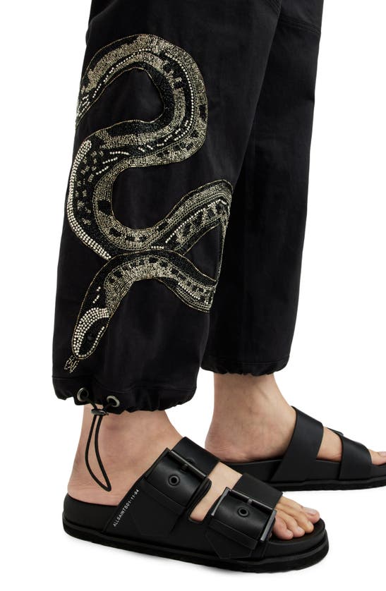Shop Allsaints Snake Embroidered Pants In Washed Black