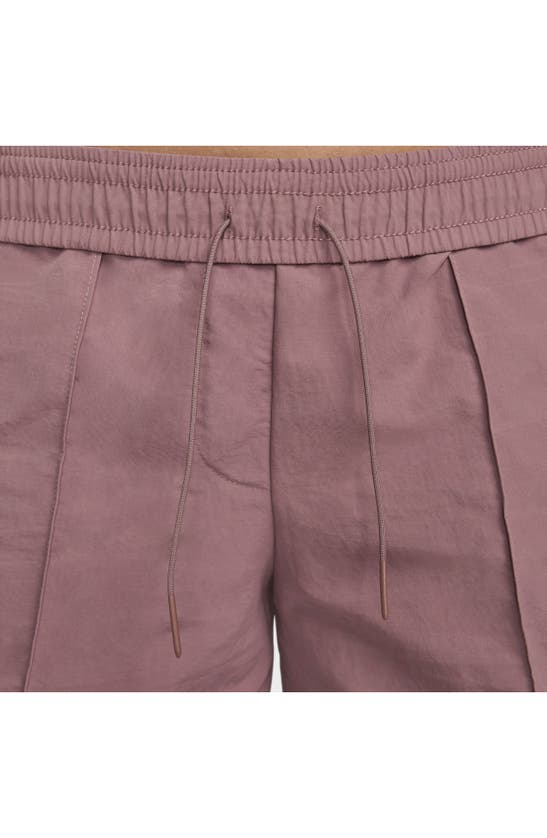 Shop Nike Sportswear Everything Wovens Water Repellent Mid Rise 5-inch Shorts In Smokey Mauve/ Black