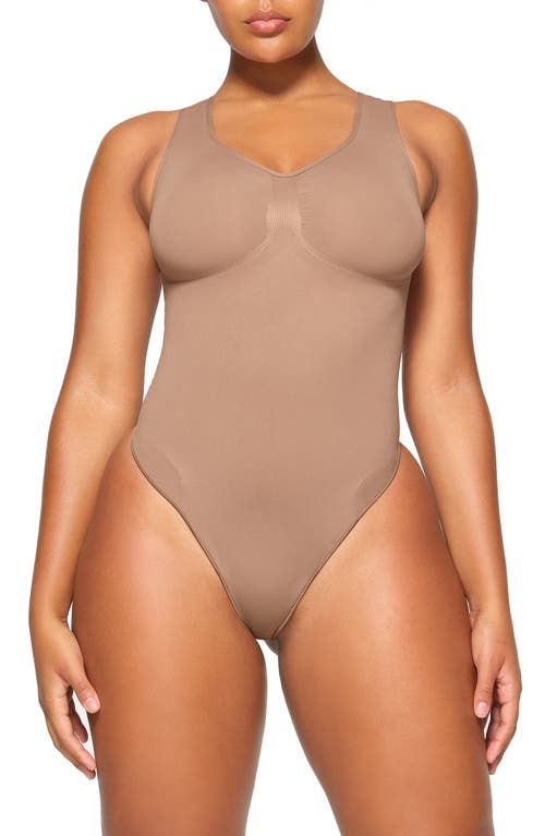 Skims Soft Smoothing Seamless Thong Bodysuit In Clay color size