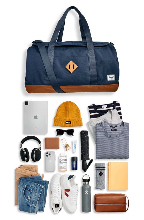 Shop Herschel Supply Co . Heritage Duffle Bag In Navy/saddle Brown