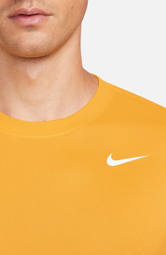 Shop Nike Dri-fit Legend T-shirt In University Gold/ White