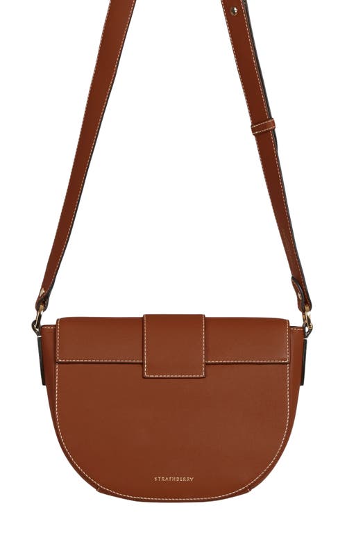 Shop Strathberry Crescent Saddle Leather Crossbody Bag In Chestnut/vanilla