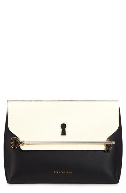 Click to view more detailed imagery on our partner's website Strathberry East/west Stylist Keyhole Leather Clutch In Black/ Vanilla
