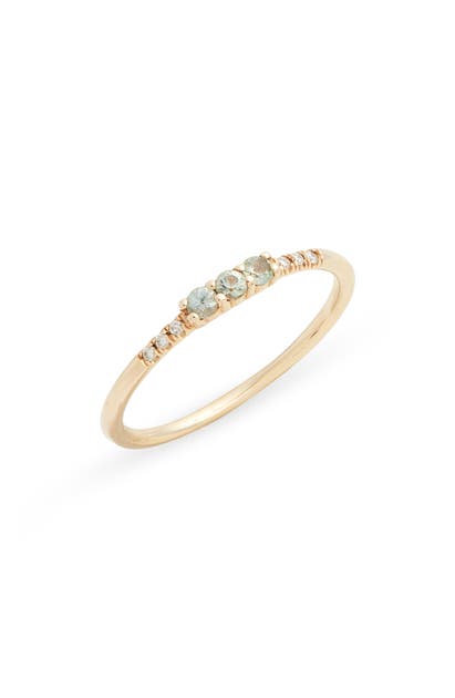 Click to view more detailed imagery on our partner's website Jennie Kwon Designs Three Green Sapphire Equilibrium Ring In Yellow Gold/ Green Sapphire