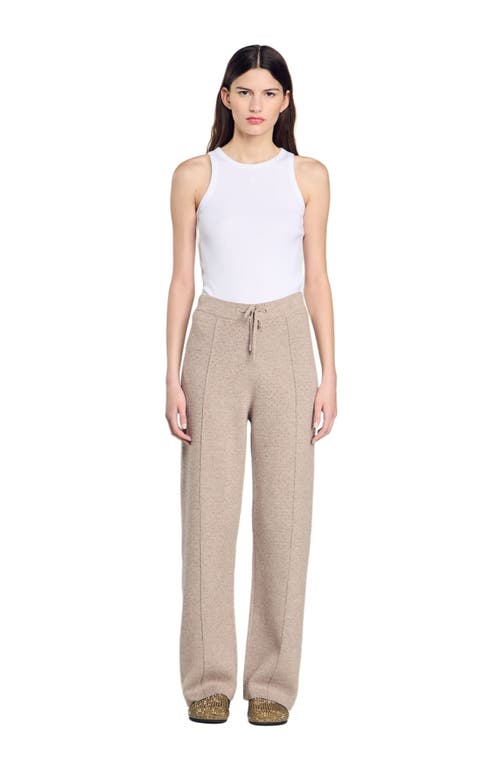 Shop Sandro Knit Rhinestone-covered Trousers In Beige