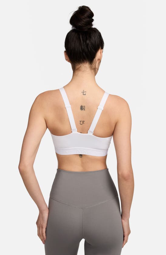 Shop Nike Indy Dri-fit Medium Support Sports Bra In White