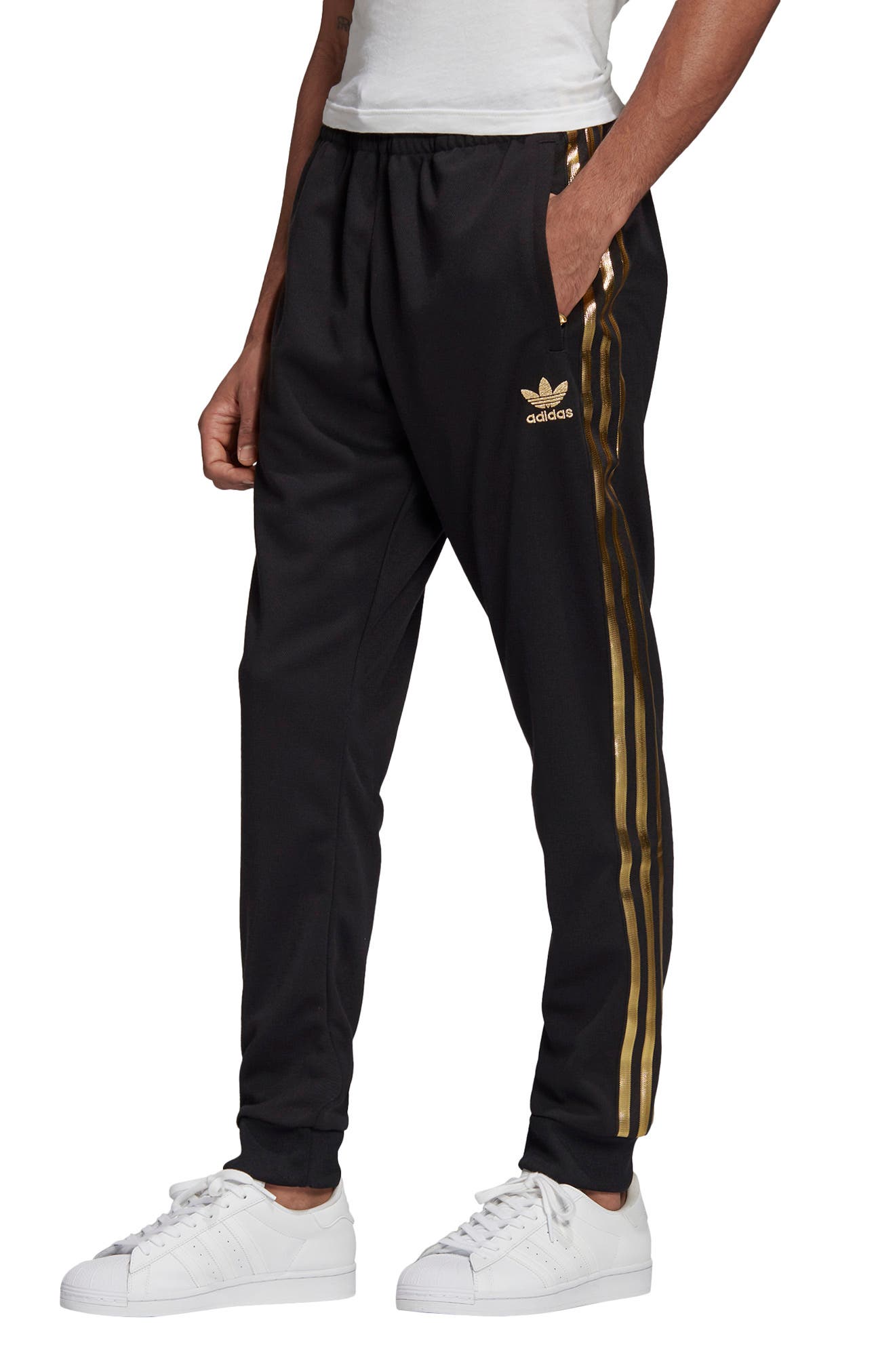 black and gold adidas track pants