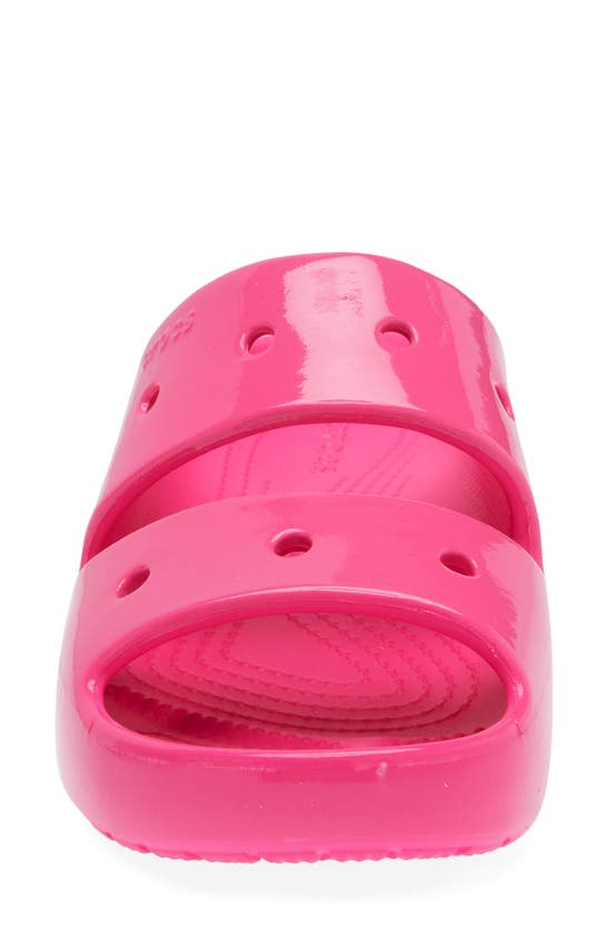 Shop Crocs Classic Neon Slide Sandal In Pink Crush
