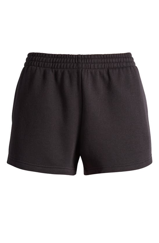Shop Skims Fleece Sweat Shorts In Onyx