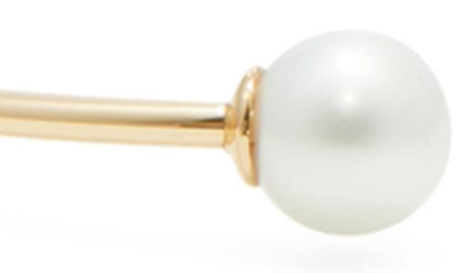 Shop Tory Burch Kira Imitation Pearl Cuff Bracelet In Tory Gold/ivory Pearl