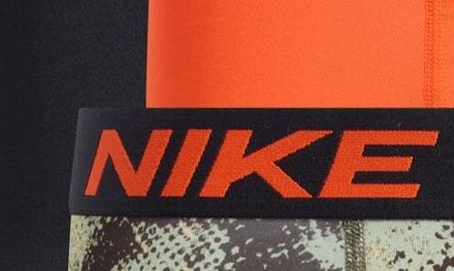 Shop Nike 3-pack Dri-fit Essential Micro Trunks In Cargo Camo/team Orange/black