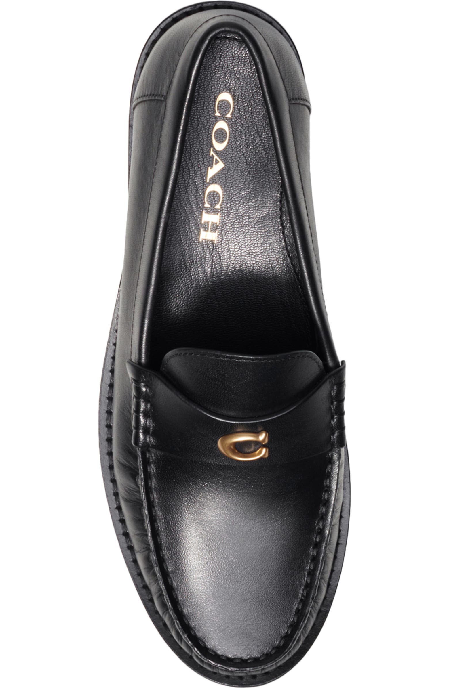 A stylish woman’s loafer shoe, symbolizing the polished yet constrained roles often assigned to women in leadership