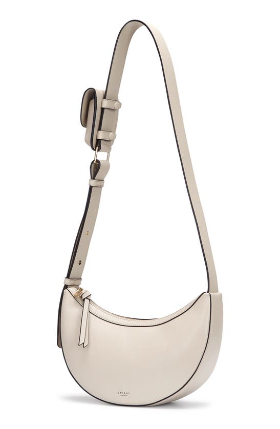 Shop Oryany Rookie Crescent Crossbody Bag In Cream