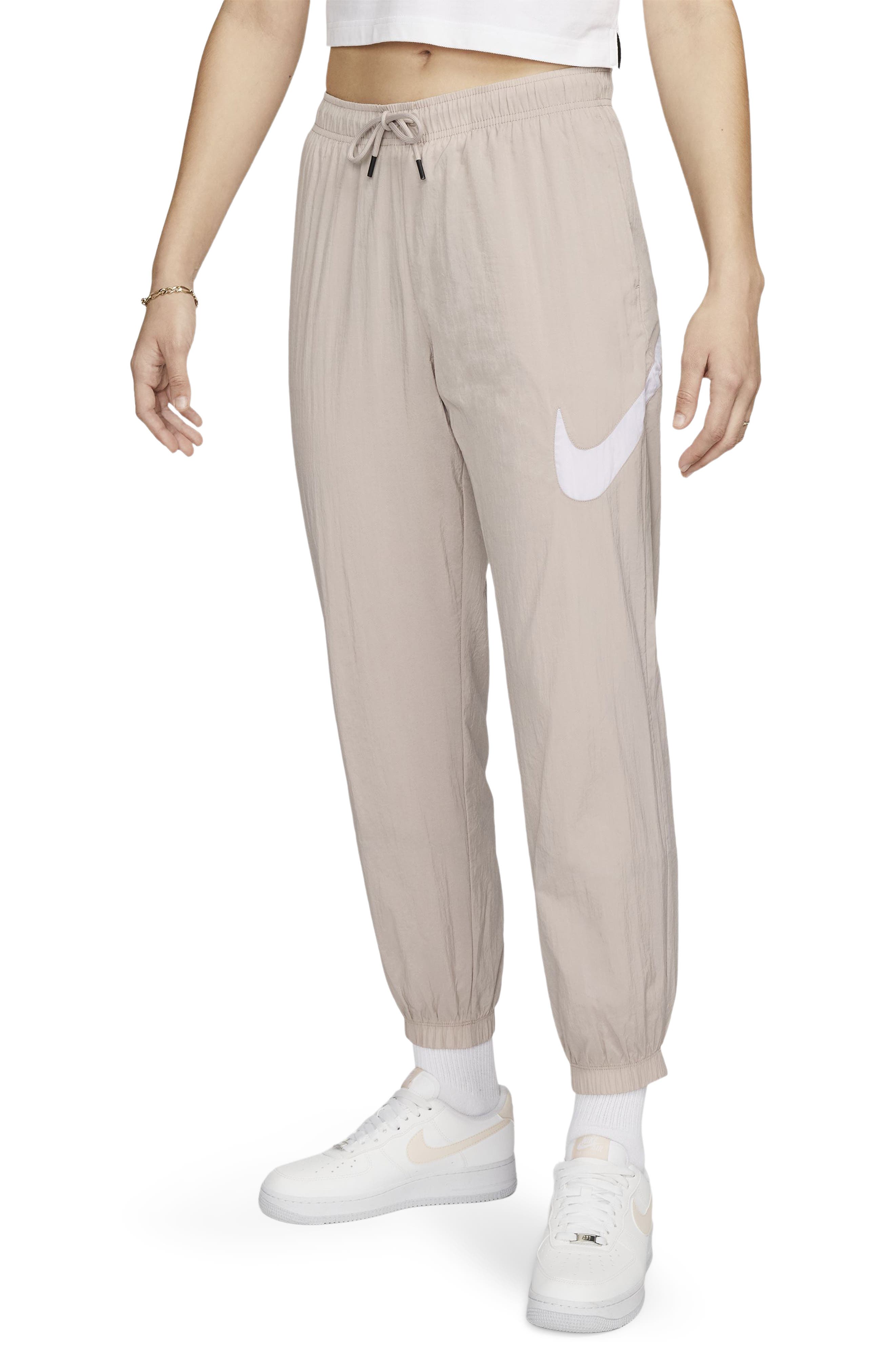 Nike Mini Swoosh wide leg joggers in taupe