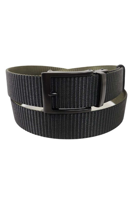 Shop Vince Camuto Reversible Ratchet Buckle Web Belt In Black/ Olive