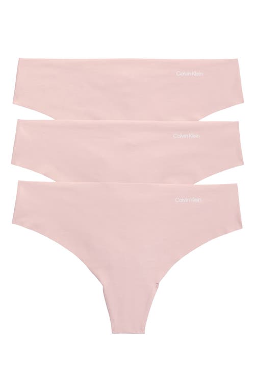 Shop Calvin Klein Invisibles 3-pack Thongs In Tqo Subdued