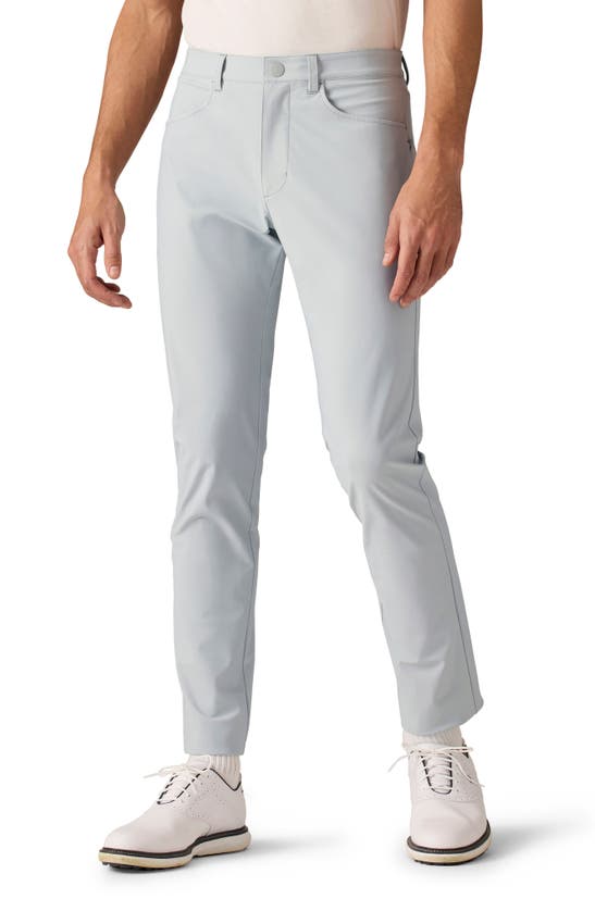 Shop Rhone Momentum Water Repellent Flat Front Golf Pants In Blue Stone