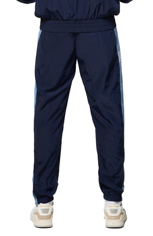 Shop Sergio Tacchini Angolo Zip Cuff Crinkle Nylon Track Pants In Maritime Blue