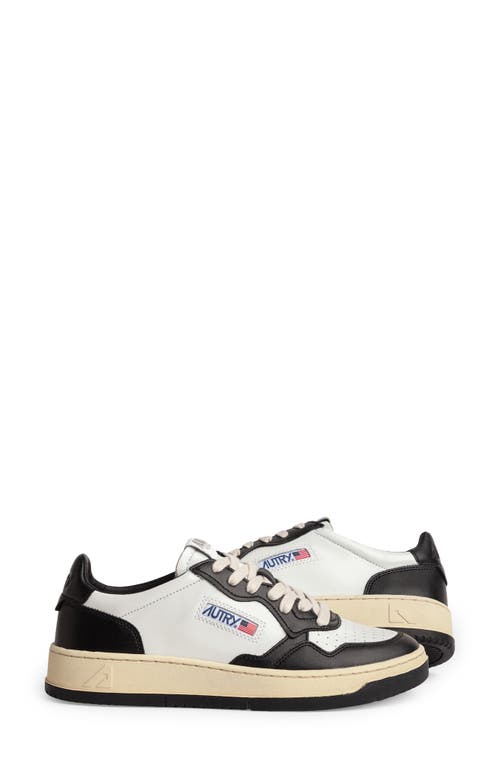 Shop Autry Medalist Low Sneaker In White/black