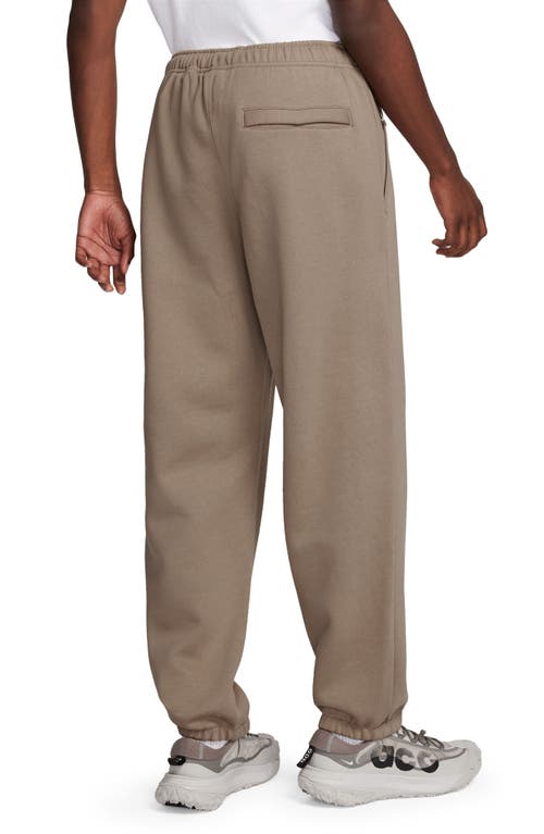 Shop Nike Acg Lungs Therma-fit Repel Tuff Fleece Pants In Khaki/light Iron Ore/white