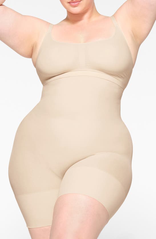 Skims Seamless Sculpt Low Back Mid Thigh Bodysuit In Sand