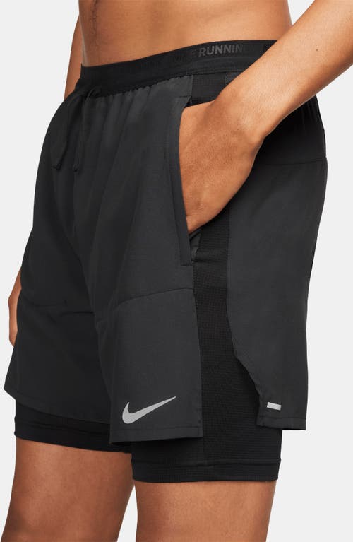 Shop Nike Dri-fit Stride Hybrid Running Shorts In Black/black/black