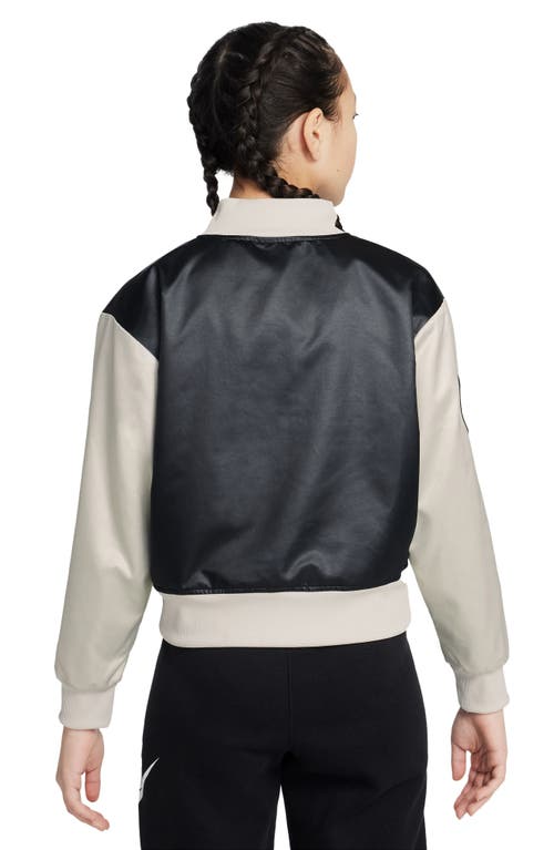 Shop Nike Kids' Sportswear Satin Varsity Jacket In Black/light Bone