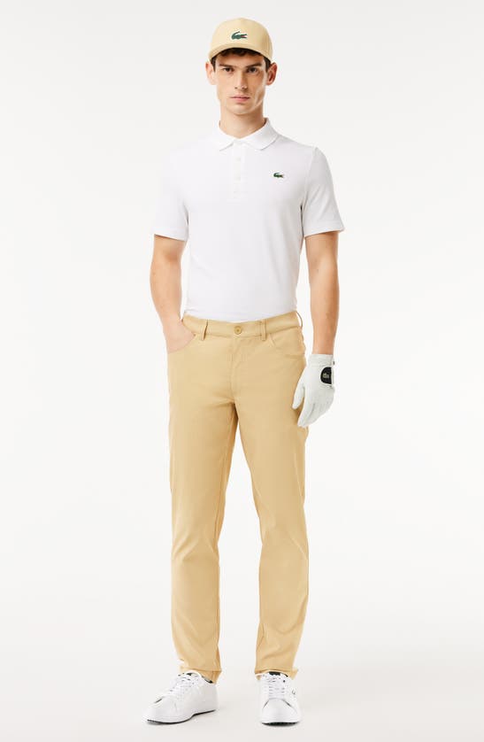 Shop Lacoste Slim Fit Performance Golf Pants In Croissant